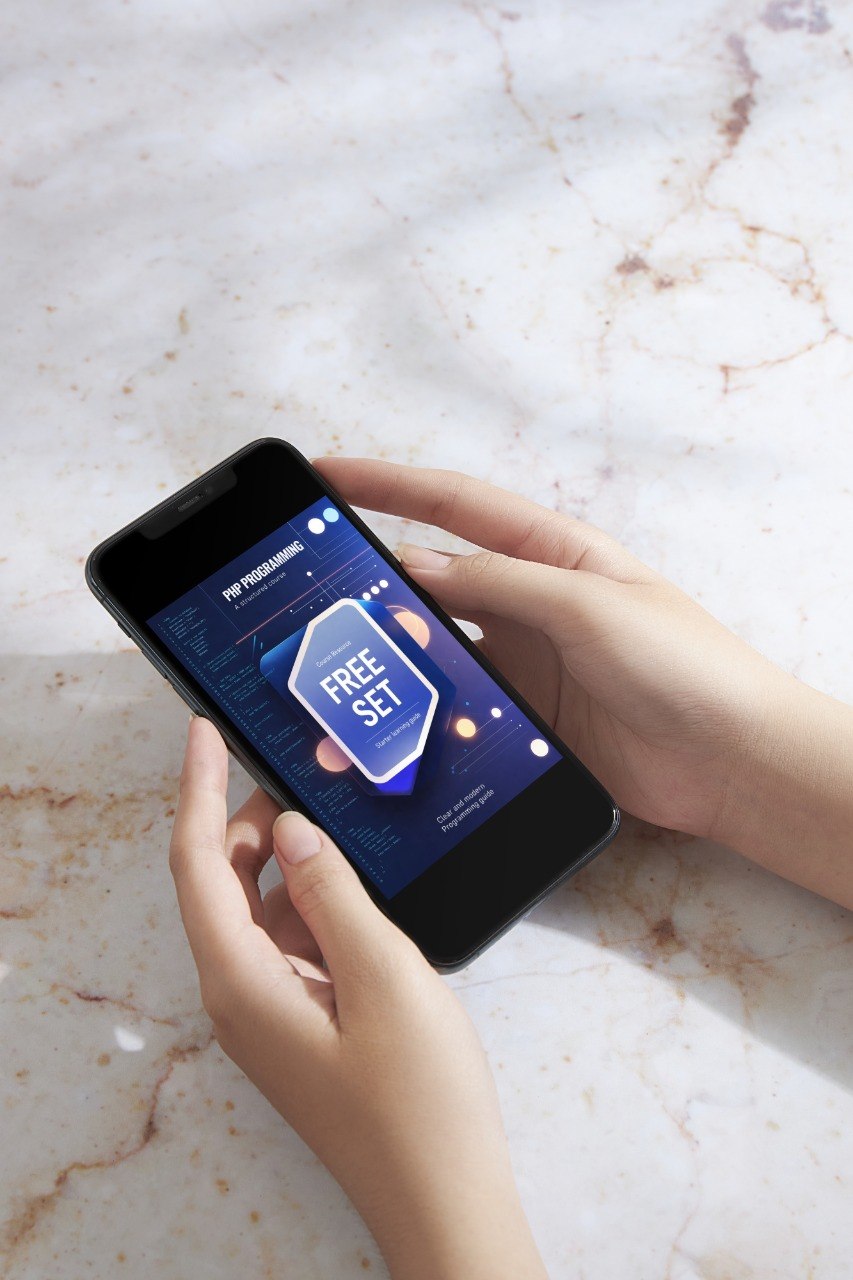 Person holding a smartphone with an app on a marble surface